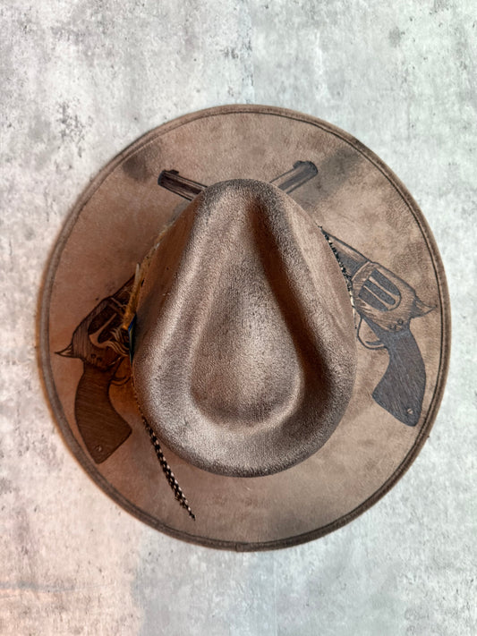 Brown revolver pistols burned wide brim rancher hat