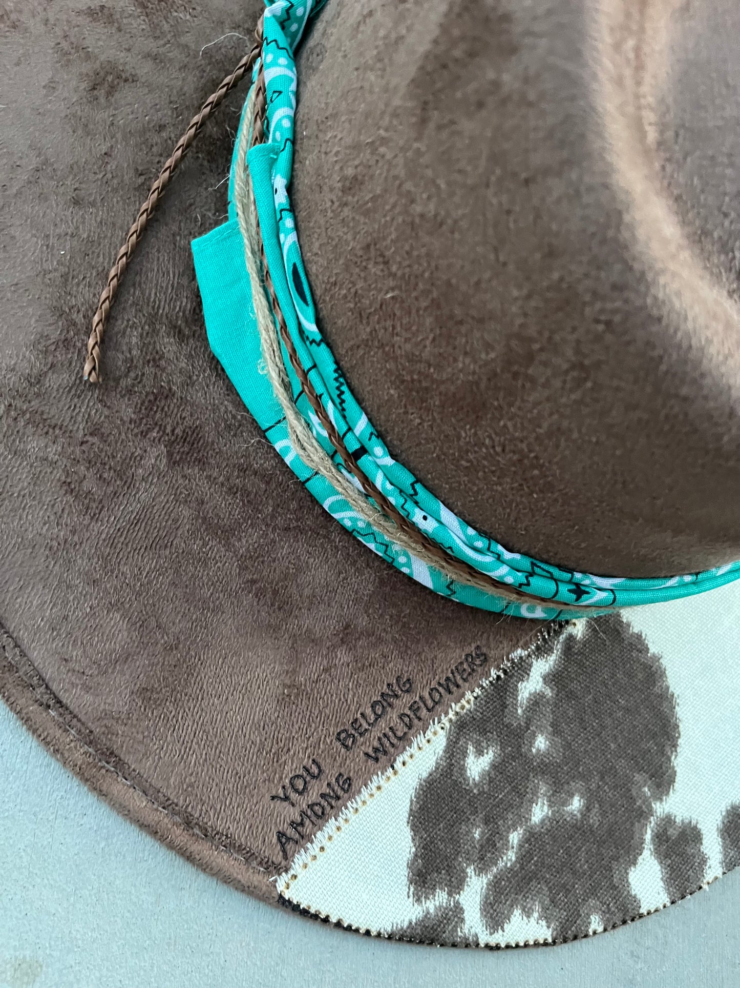 Mocha brown floral cowhide burned fabric lined felt wide brim rancher hat