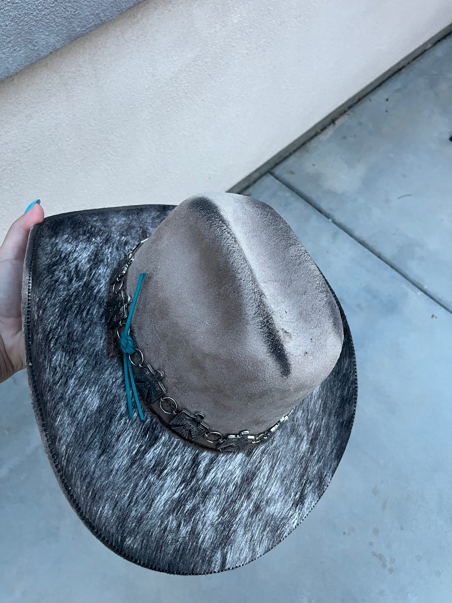 Taupe fabric lined accessorized burned suede wide brim cowboy hat