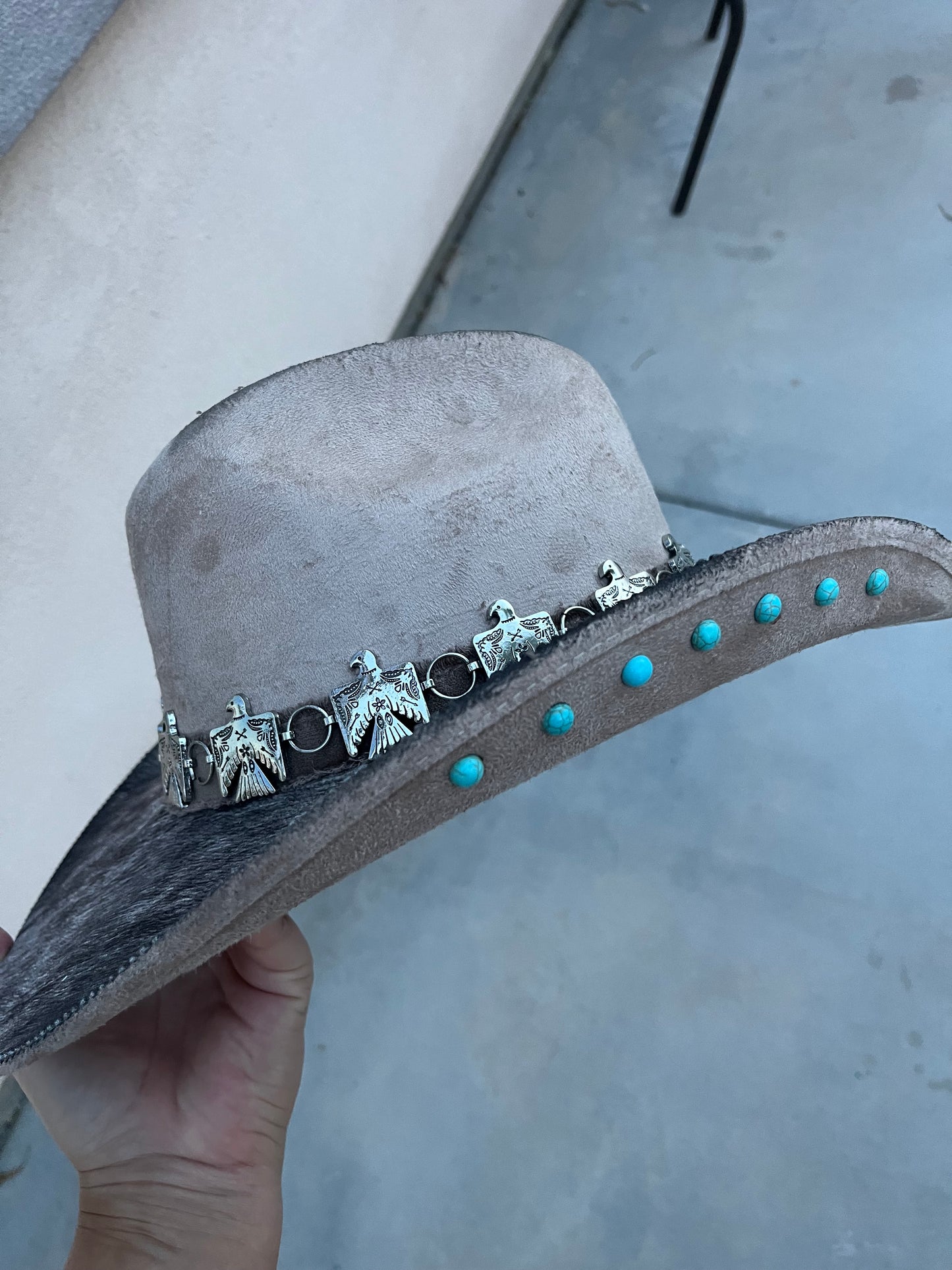 Taupe fabric lined accessorized burned suede wide brim cowboy hat
