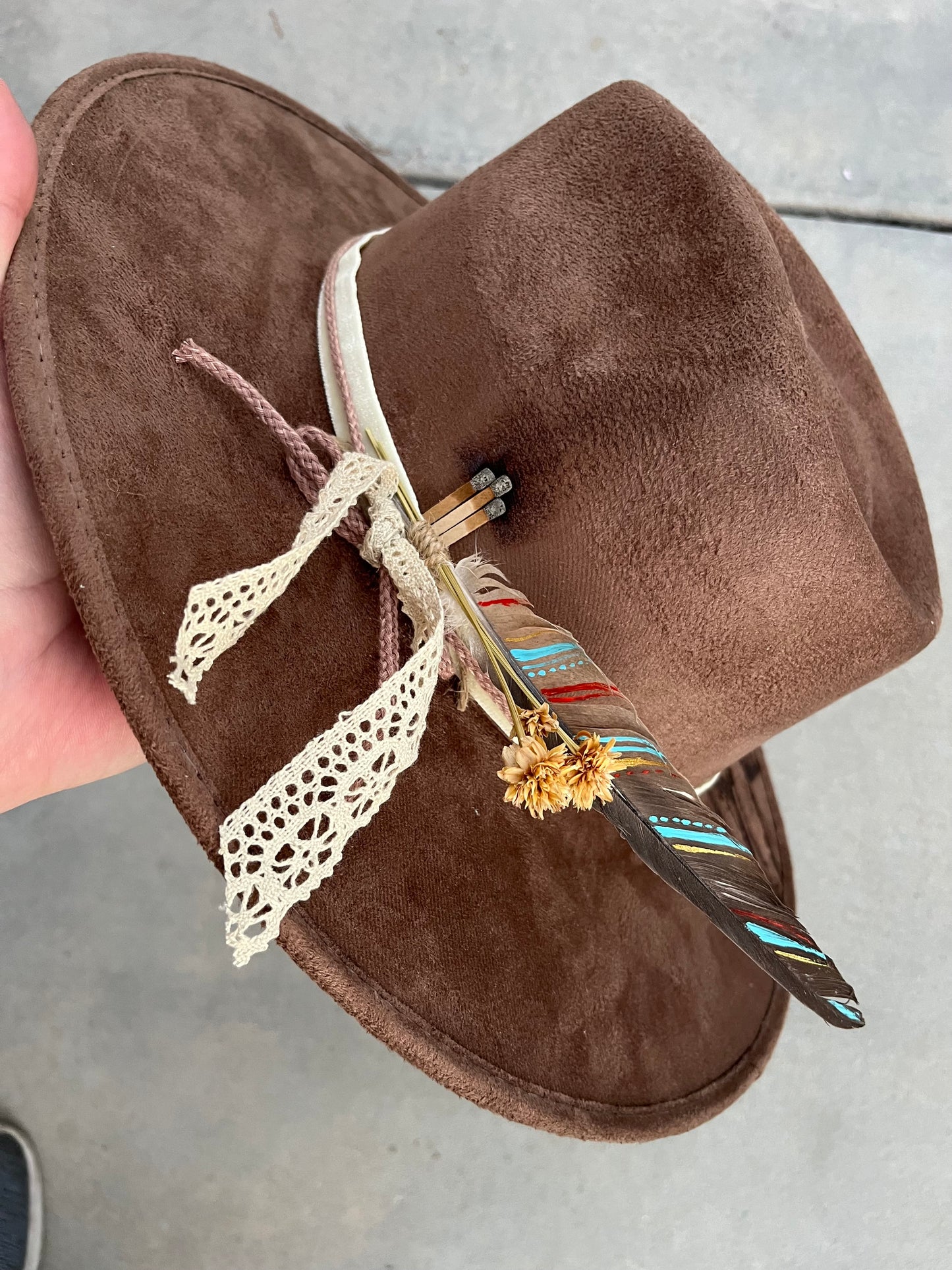 Brown distressed horses burned accessorized fabric lined suede wide brim rancher hat