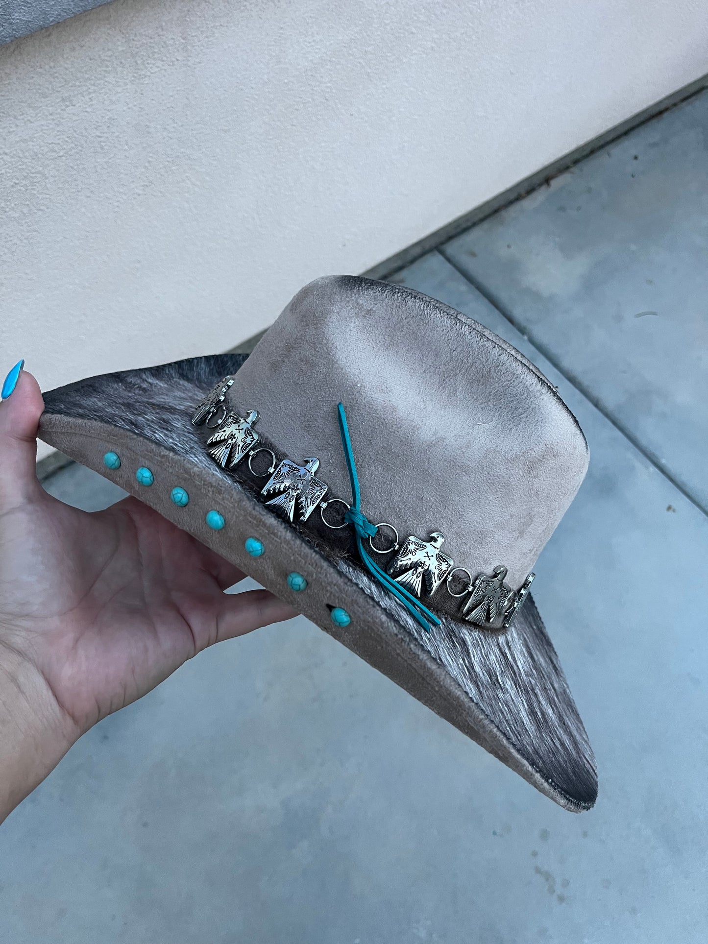 Taupe fabric lined accessorized burned suede wide brim cowboy hat