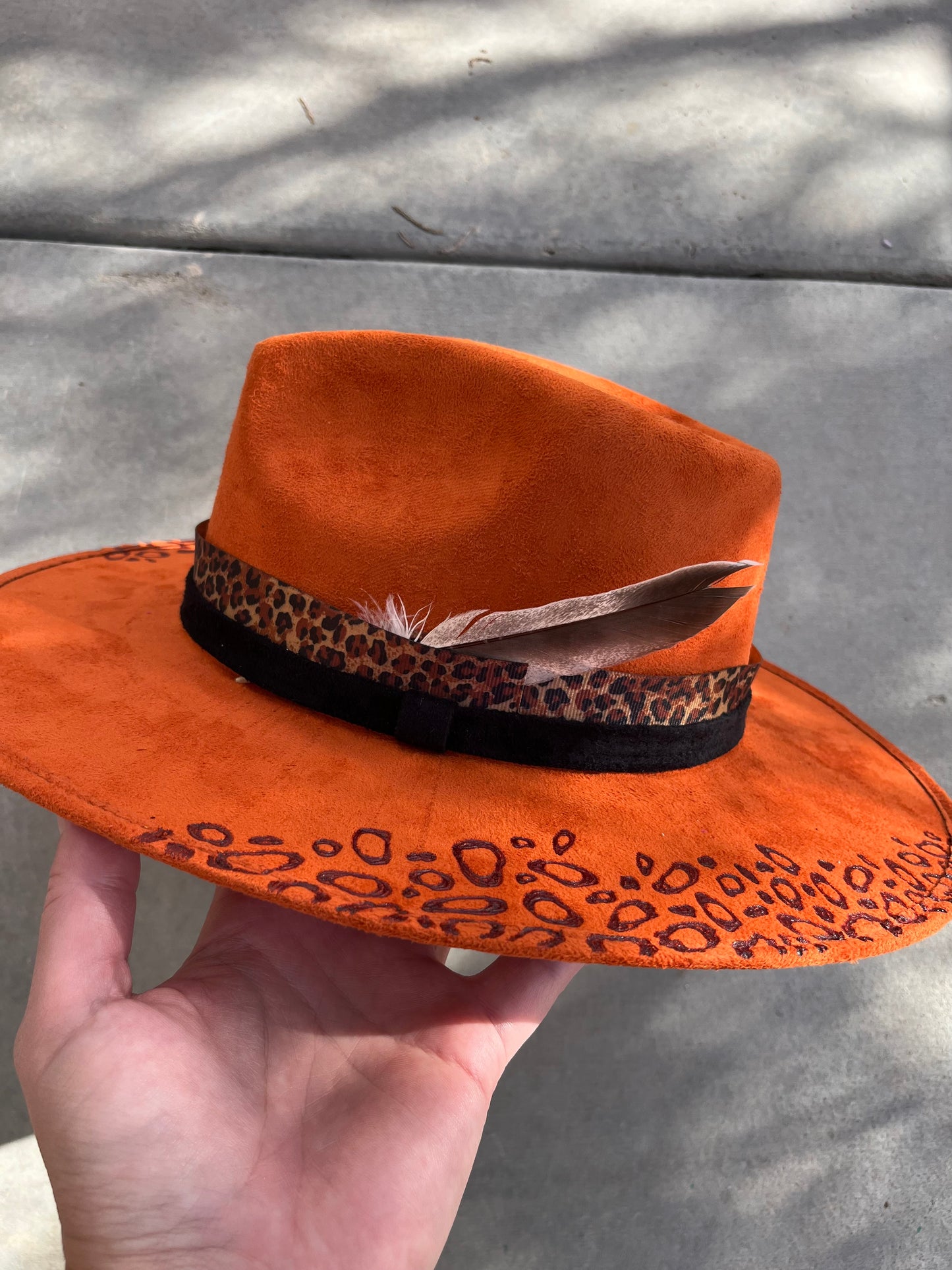 Orange leopard cheetah burned accessorized suede wide brim rancher hat