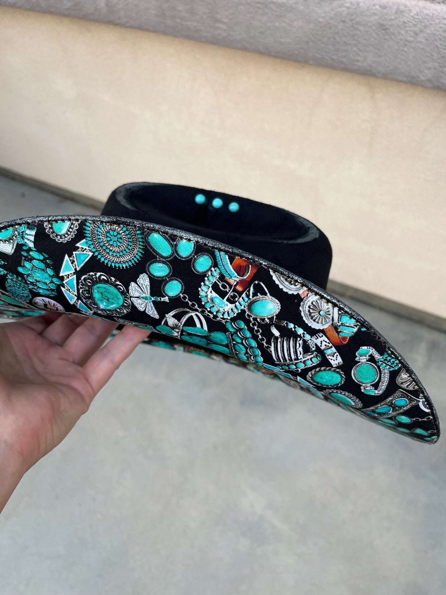 Black fabric lined turquoise burned suede wide brim cowboy hat