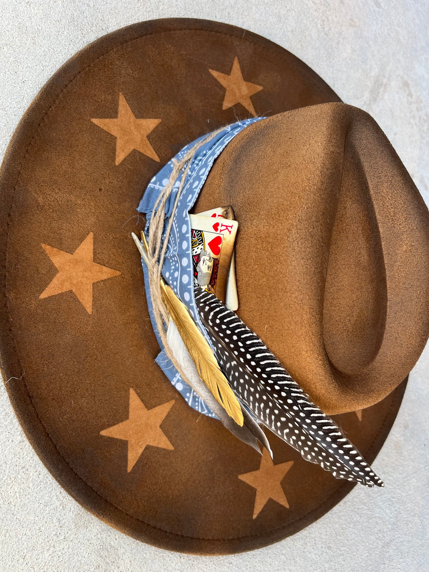Tan star accessorized burned suede wide brim rancher hat