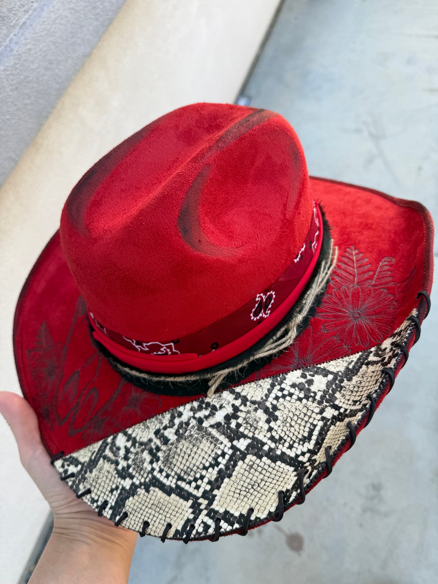 Red snakeskin wide brim cowboy hat