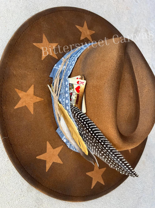 Tan star accessorized burned suede wide brim rancher hat