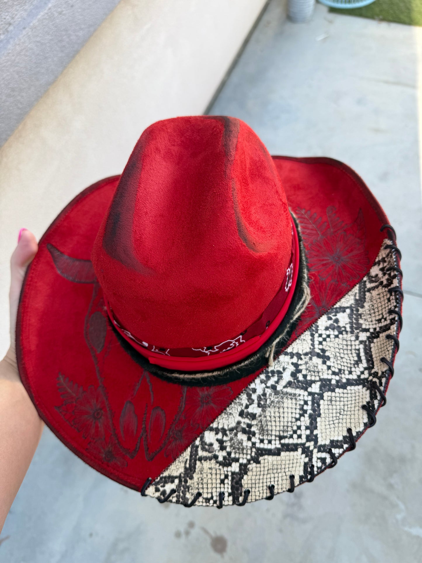Red snakeskin wide brim cowboy hat