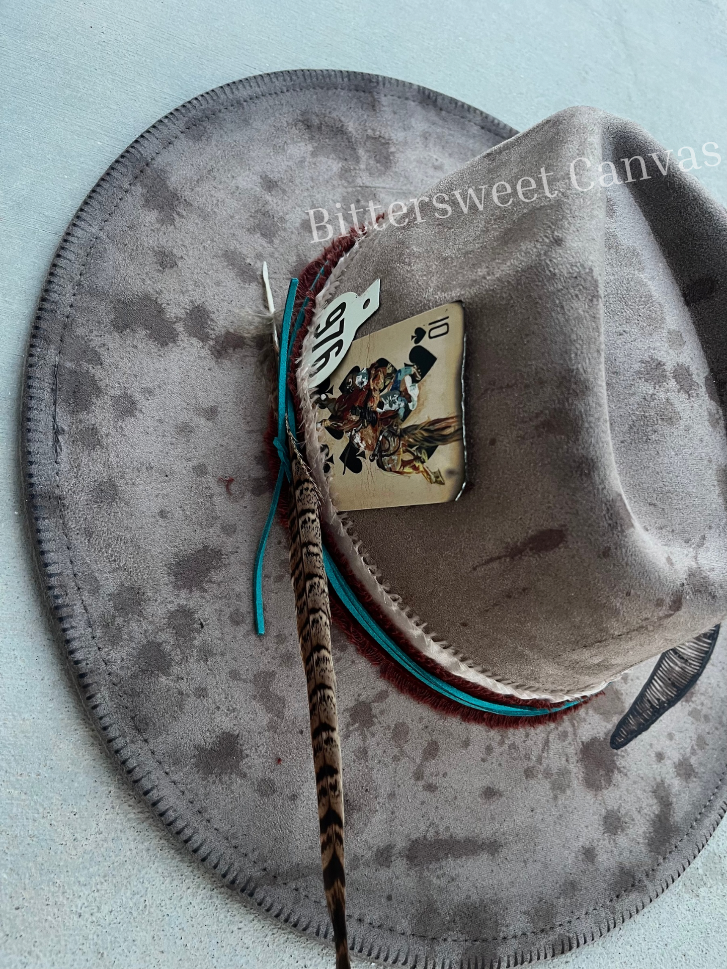 Distressed taupe steer head suede wide brim rancher hat