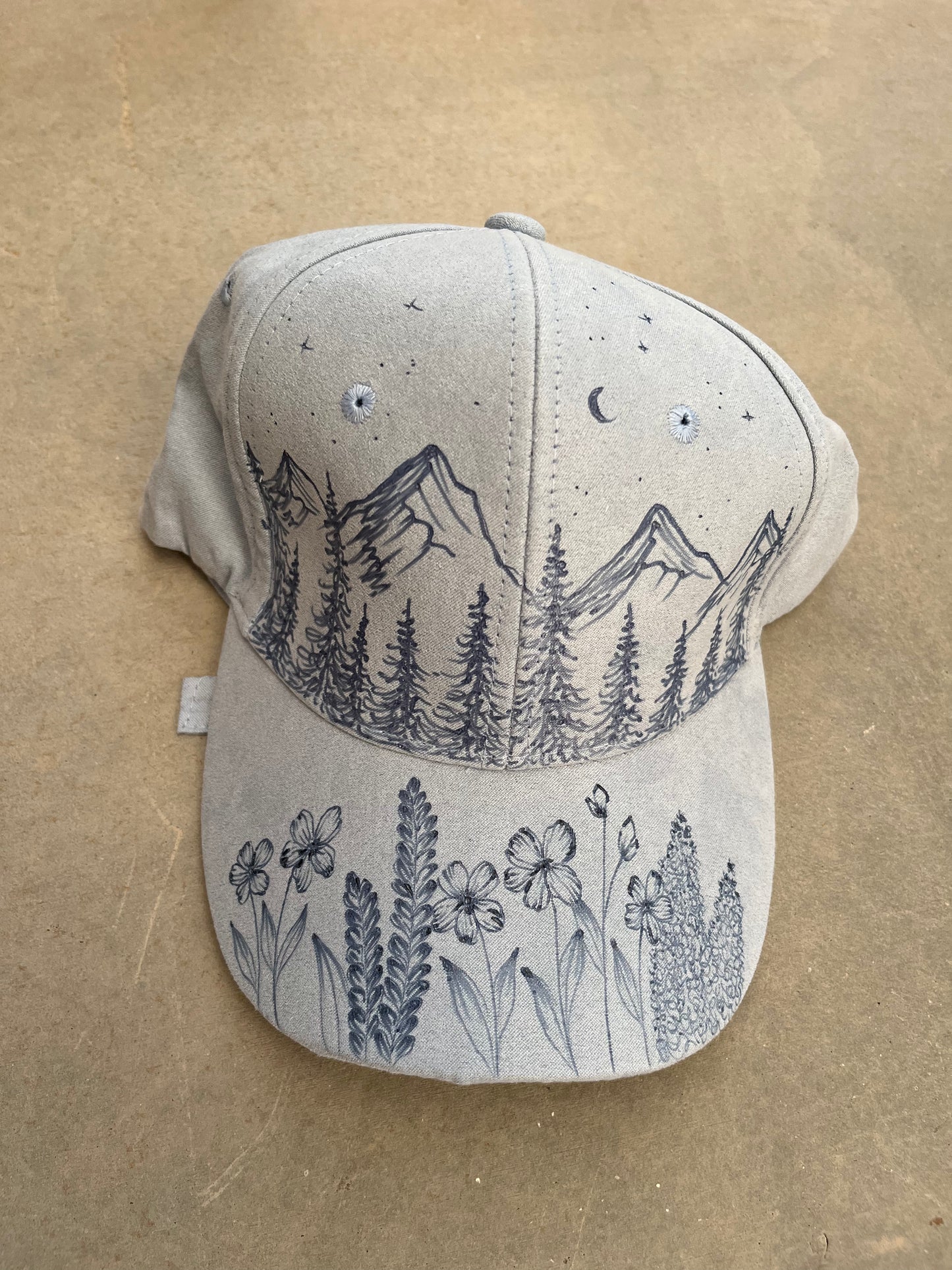Burned blue mountain ball cap
