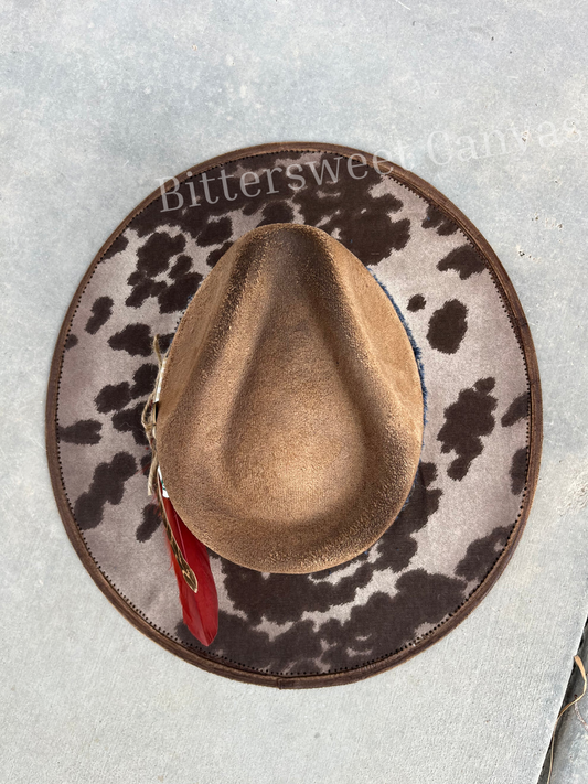 Tan cow hide burned fabric lined felt wide brim rancher hat