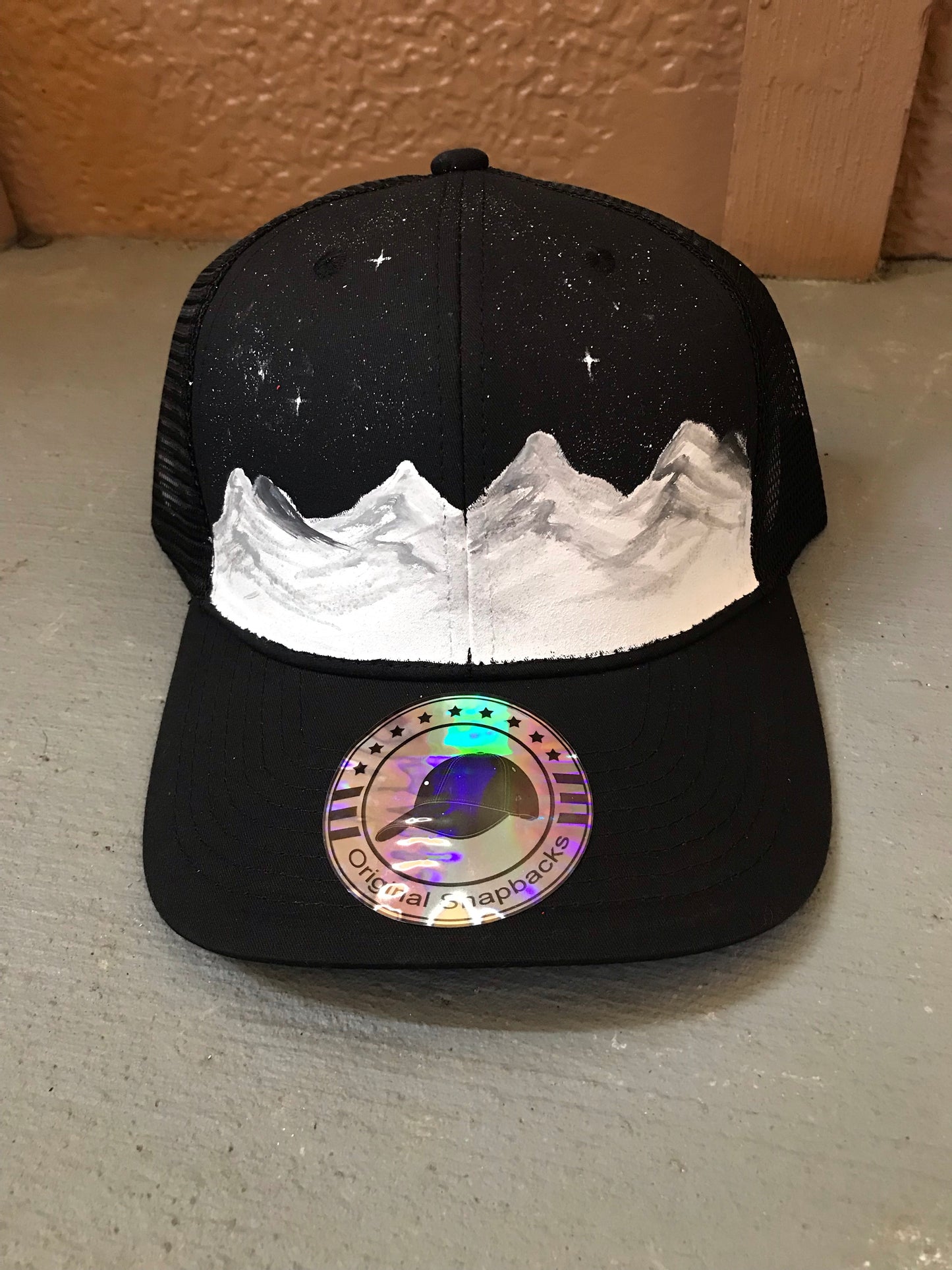 Black sky white mountain hat