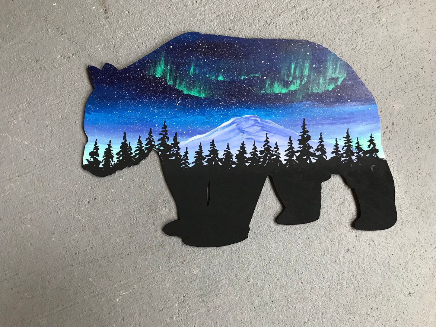 Bear wood cutout painting northern lights